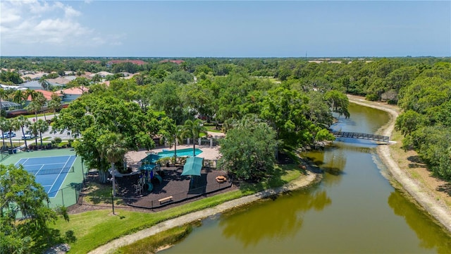 aerial view with a water view and a forest view