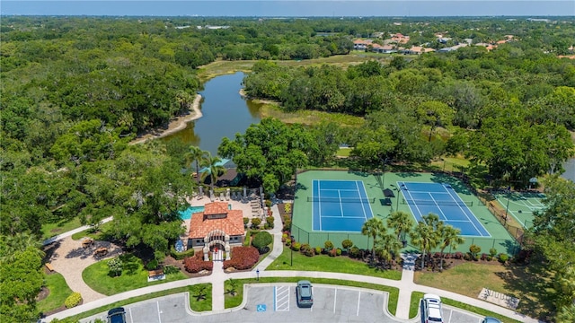 aerial view featuring a water view and a view of trees