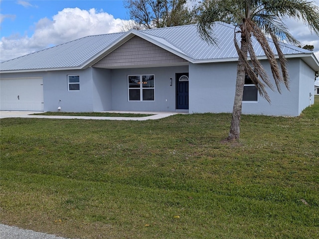 ranch-style house featuring metal roof, a front lawn, and stucco siding