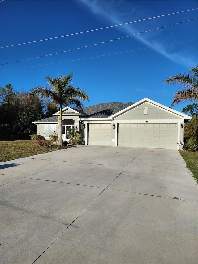 view of front of home featuring stucco siding, an attached garage, and concrete driveway