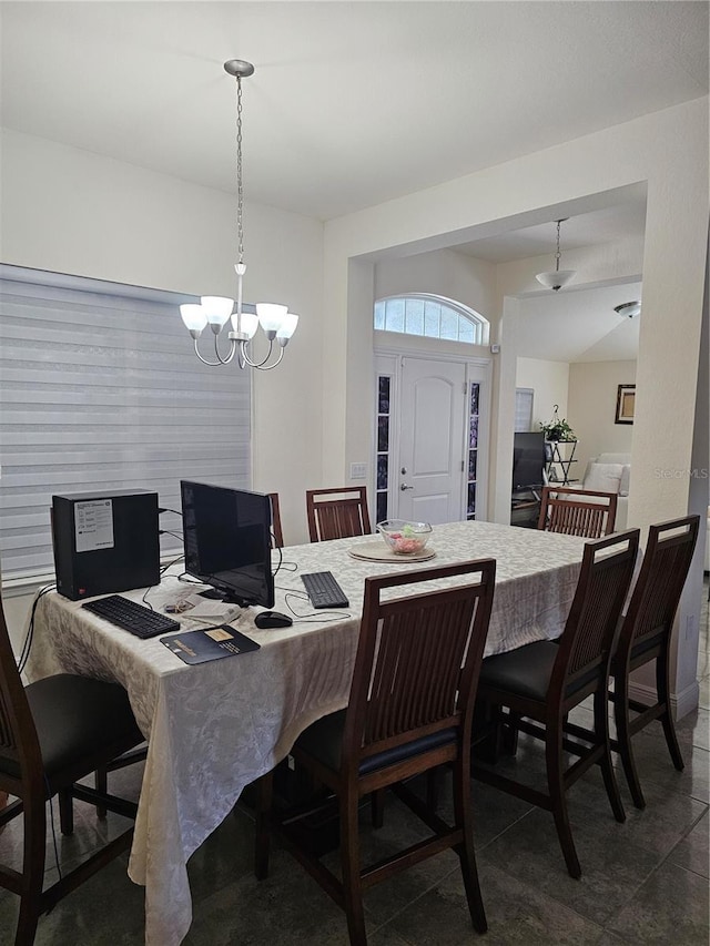 dining space with a notable chandelier