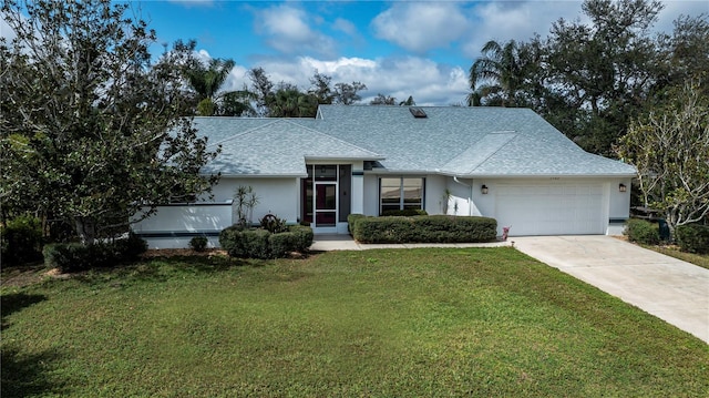 view of front of property featuring a garage, a front lawn, roof with shingles, and stucco siding