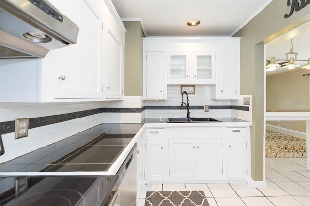 kitchen featuring light tile patterned floors, decorative backsplash, white cabinetry, a sink, and exhaust hood