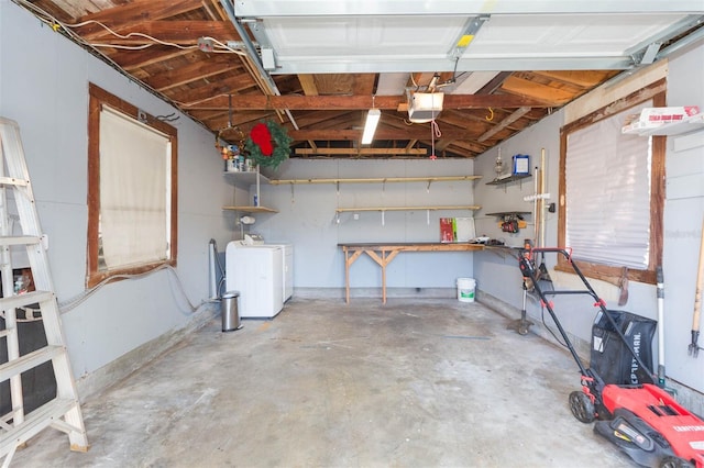 garage featuring a garage door opener and washing machine and dryer