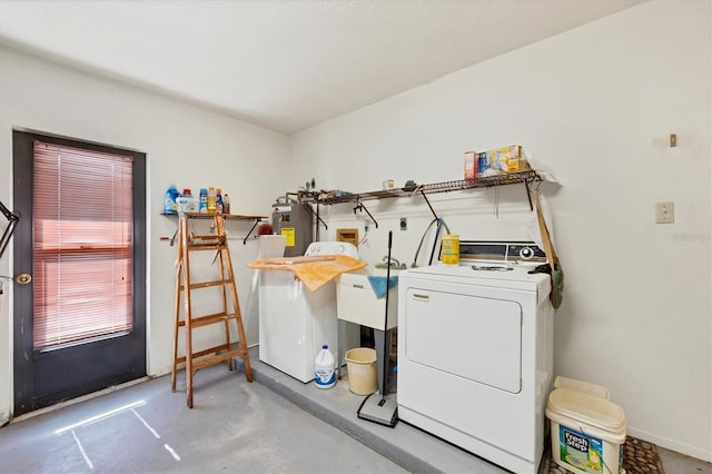 laundry room featuring washer / clothes dryer, laundry area, and water heater