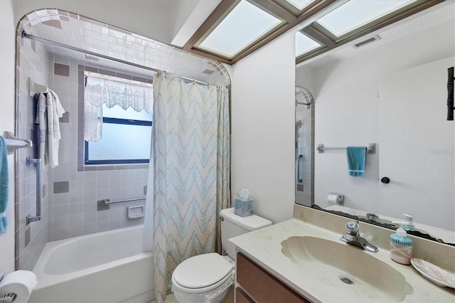 bathroom featuring visible vents, shower / tub combo, toilet, and vanity