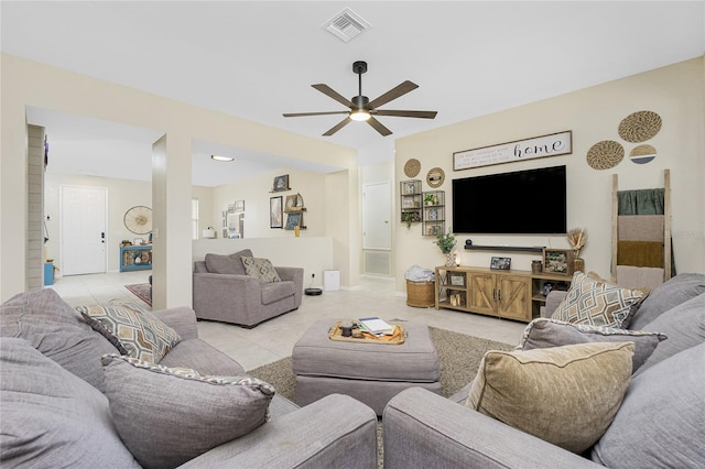 living room featuring visible vents, a ceiling fan, and light tile patterned flooring