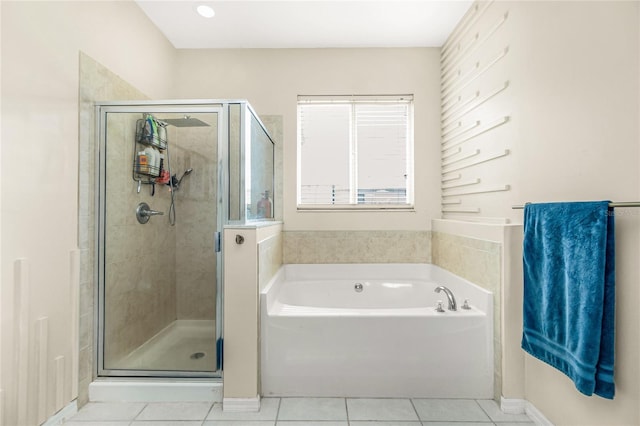 full bath with a garden tub, tile patterned flooring, and a stall shower