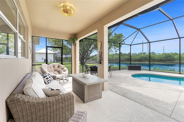 pool with outdoor lounge area, a patio area, a lanai, and a water view