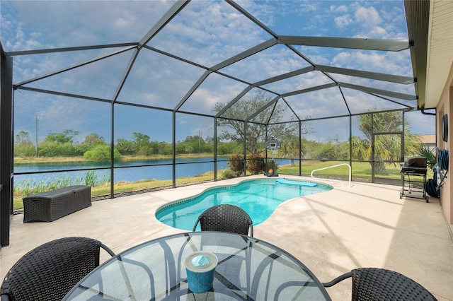 pool with a water view, a patio area, a lanai, and area for grilling