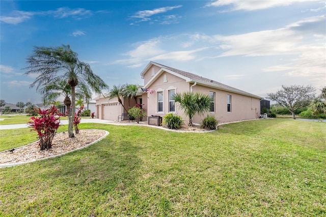 view of side of home featuring a garage, concrete driveway, a lawn, and stucco siding