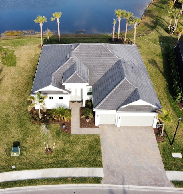 birds eye view of property featuring a water view