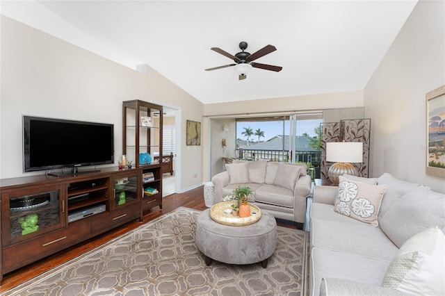 living room with lofted ceiling, ceiling fan, baseboards, and wood finished floors