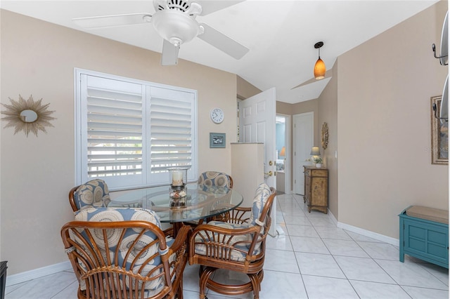 dining room featuring light tile patterned floors, ceiling fan, and baseboards