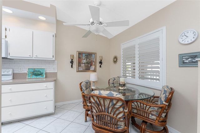 dining room featuring light tile patterned floors, ceiling fan, and baseboards