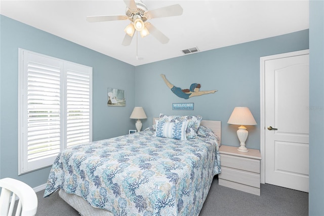 bedroom with a ceiling fan, visible vents, and carpet flooring