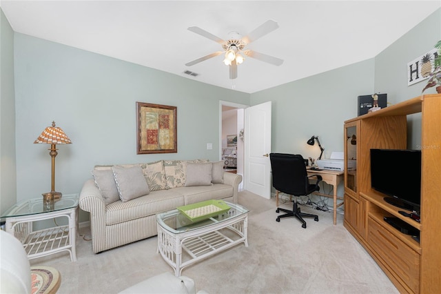 interior space with carpet, visible vents, and a ceiling fan