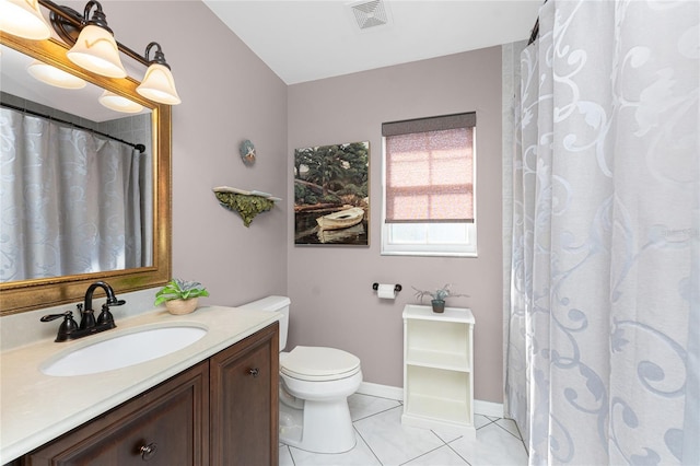 full bath featuring toilet, vanity, baseboards, visible vents, and tile patterned floors