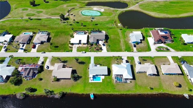 birds eye view of property featuring a residential view and a water view