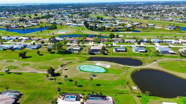 aerial view with a residential view, a water view, and golf course view