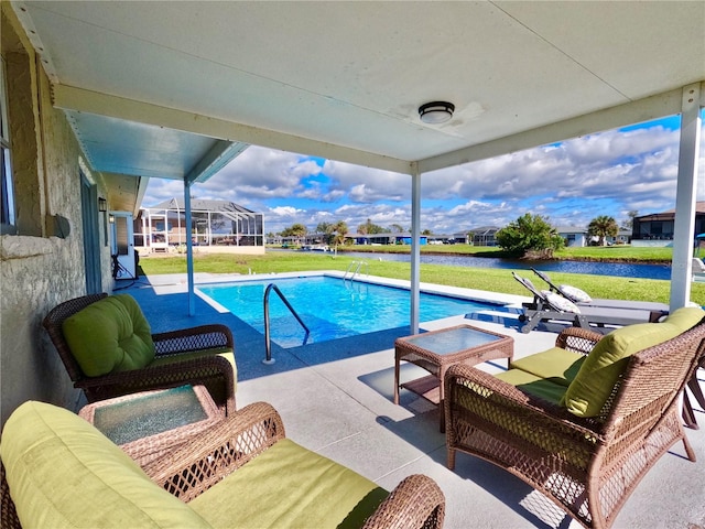 outdoor pool featuring an outdoor hangout area, a yard, and a patio area