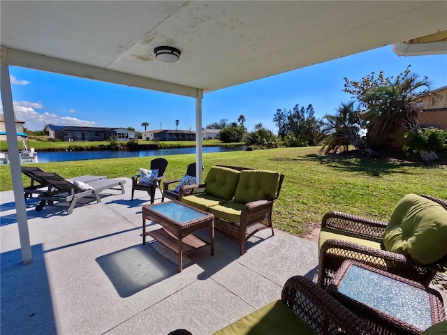 view of patio with outdoor lounge area and a water view