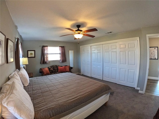 bedroom with carpet, a closet, visible vents, ceiling fan, and baseboards