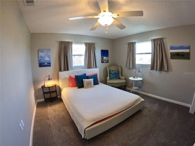 bedroom featuring baseboards, visible vents, a ceiling fan, a textured ceiling, and carpet flooring