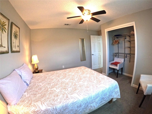 carpeted bedroom with baseboards, visible vents, ceiling fan, a textured ceiling, and a closet