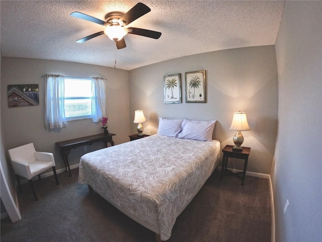 carpeted bedroom featuring a textured ceiling, ceiling fan, and baseboards