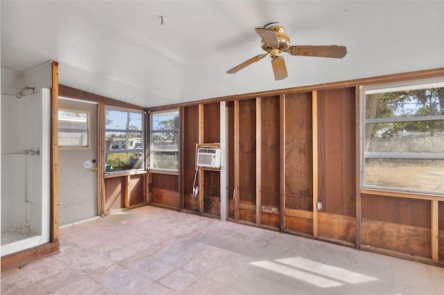 unfurnished sunroom with lofted ceiling and ceiling fan