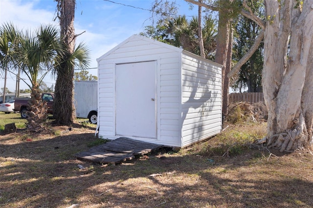 view of shed with fence