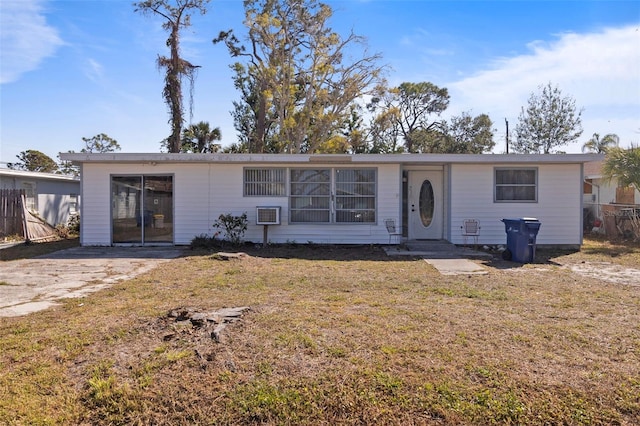 view of front of property with fence and a front lawn