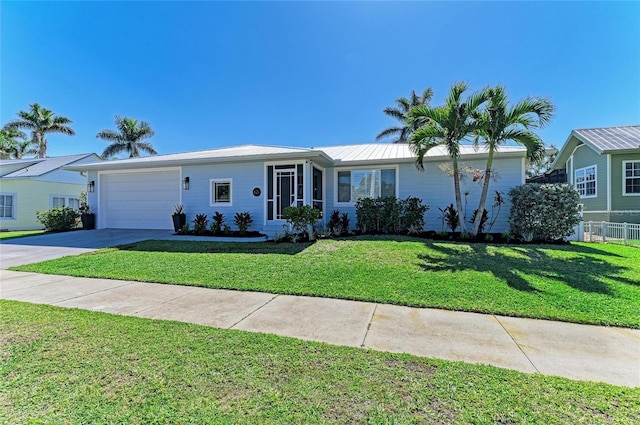 ranch-style house with driveway, a front lawn, an attached garage, and fence