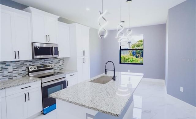 kitchen featuring stainless steel appliances, a sink, marble finish floor, backsplash, and light stone countertops