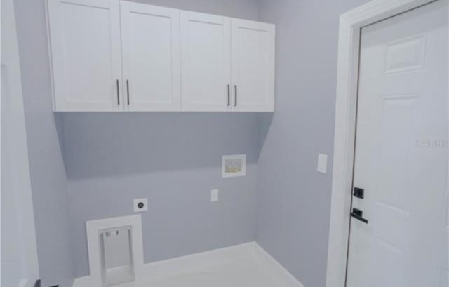 laundry room with washer hookup, hookup for an electric dryer, and cabinet space