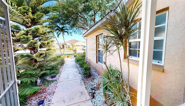 view of side of property with stucco siding