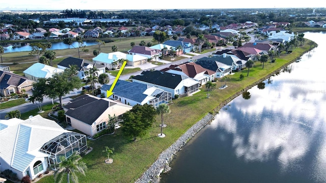 aerial view featuring a water view and a residential view