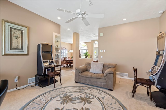 living room featuring light carpet, visible vents, and baseboards