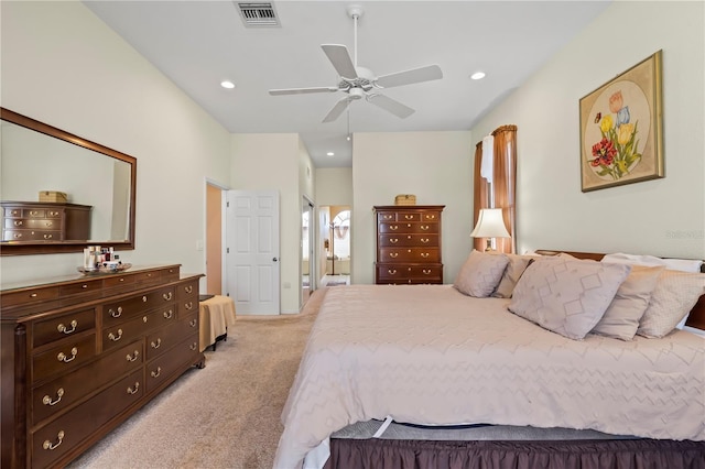 bedroom with light carpet, visible vents, a ceiling fan, ensuite bathroom, and recessed lighting