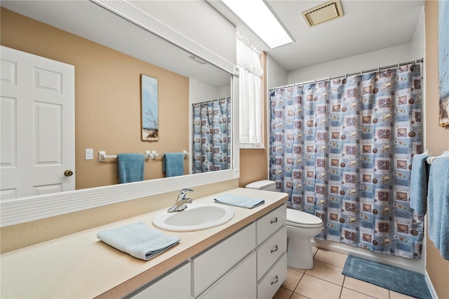 bathroom featuring visible vents, a shower with shower curtain, toilet, tile patterned floors, and vanity