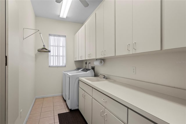 washroom with washer and clothes dryer, light tile patterned floors, cabinet space, a ceiling fan, and baseboards