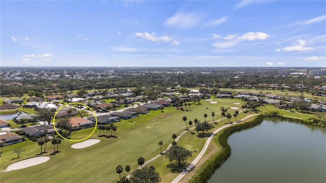 aerial view featuring a water view, view of golf course, and a residential view