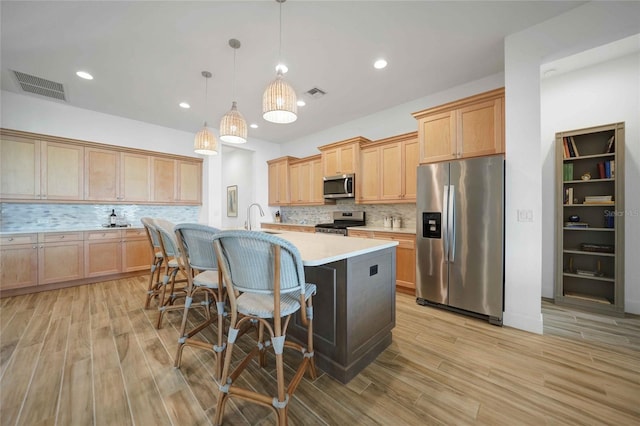 42239 Lake Timber Dr, Punta Gorda, FL 33982 - kitchen featuring light countertops, appliances with stainless steel finishes, a sink, and visible vents
