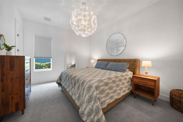 42239 Lake Timber Dr, Punta Gorda, FL 33982 - carpeted bedroom with visible vents and an inviting chandelier