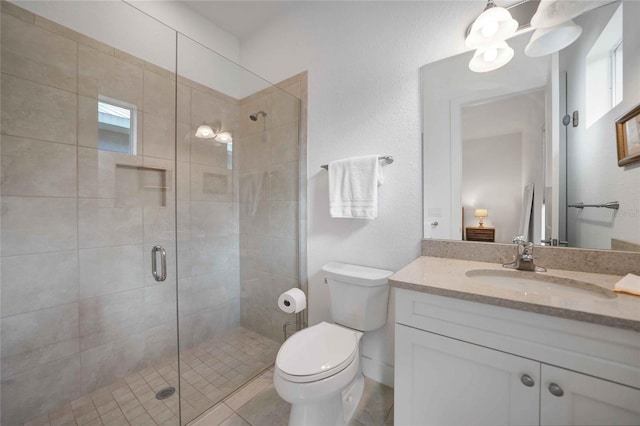 42239 Lake Timber Dr, Punta Gorda, FL 33982 - full bathroom featuring a stall shower, vanity, and toilet