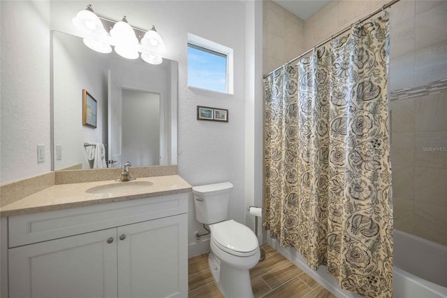 42239 Lake Timber Dr, Punta Gorda, FL 33982 - bathroom featuring a textured wall, toilet, shower / bath combo with shower curtain, vanity, and wood finish floors