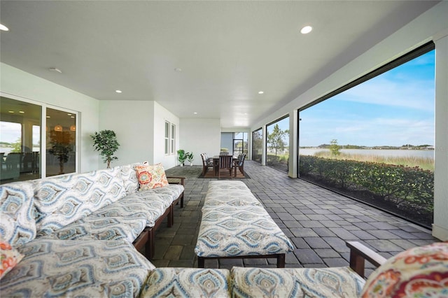 42239 Lake Timber Dr, Punta Gorda, FL 33982 - view of patio with outdoor dining space, a water view, and an outdoor living space