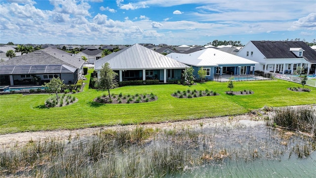 42239 Lake Timber Dr, Punta Gorda, FL 33982 - exterior space featuring metal roof, a lawn, and an outdoor pool