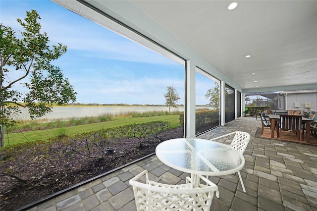42239 Lake Timber Dr, Punta Gorda, FL 33982 - sunroom / solarium with a water view